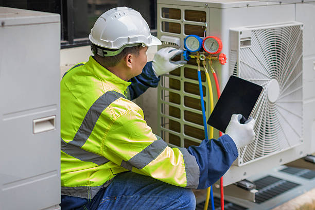 Professional Heat Pump Repair technician working in Mount Rainier, MD
